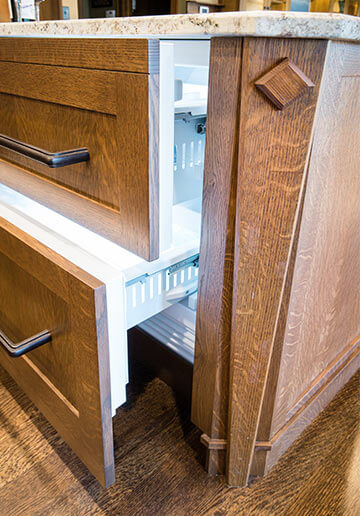 Custom panels by Silent Rivers on a freezer drawer unit built into the island of an Adel, Iowa kitchen