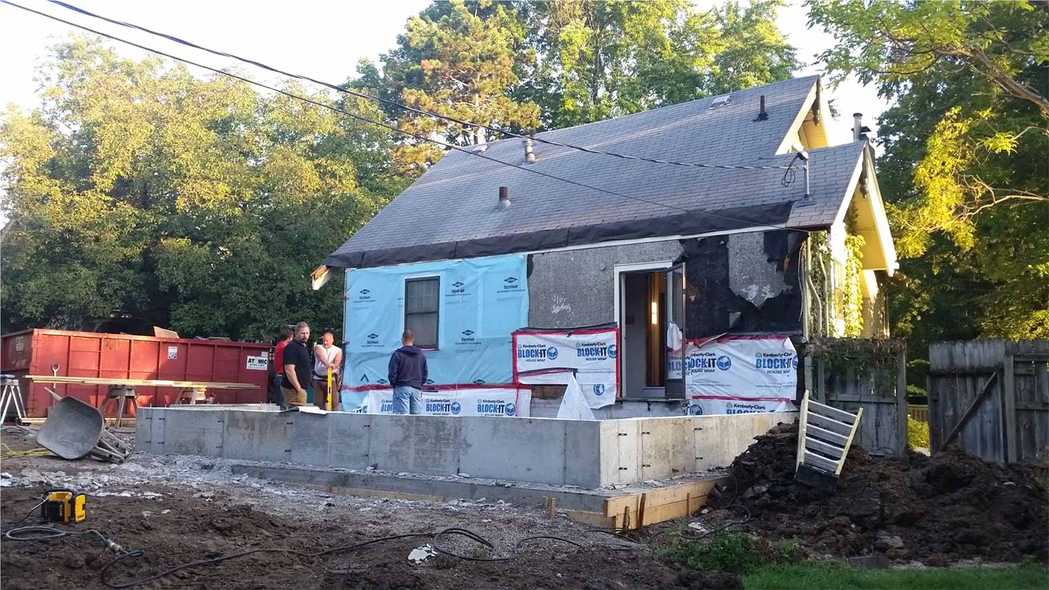 in progress remodel of 1920s Des Moines Craftsman house being remodeled by silent Rivers has foundation poured for addition