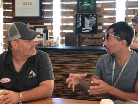 Chaden Halfhill and Gaston Carrio conversation and coffee in Creative Cafe in Silent Rivers VIP Club at 2017 Des Moines Arts Festival
