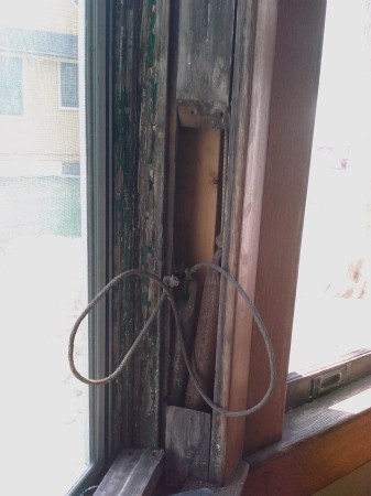 The counterweights in a historic double hung window balance out the weight of the sash, making it easier to open and close.