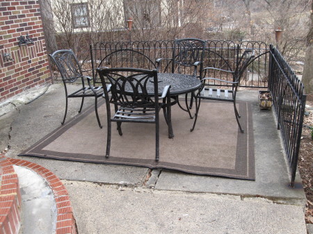 Concrete patio with table and chairs
