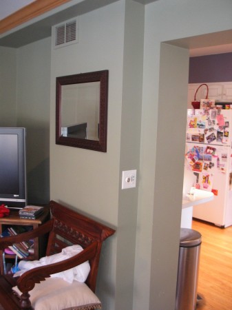 A doorway used to lead into the living room form the kitchen which reduced the amount of counter space.