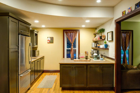 Custom cabinetry was built for the peninsula/island and main kitchen counter.
