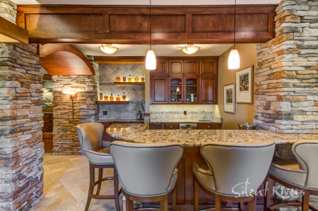 This award-winning Glen Oaks basement remodel, complete with wine cellar and theater room.