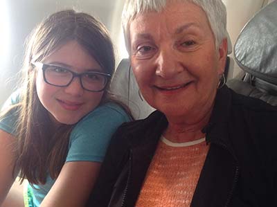 Trudy Holman Hurd and granddaughter Zoey on plane heading home to Des Moines