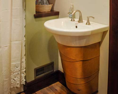 Leftover birch plywood used as a sink enclosure by Silent Rivers Design+Build