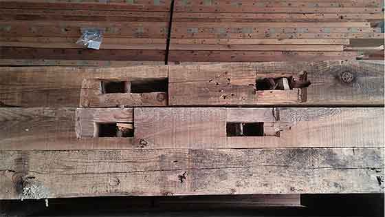 Structural lumbar from an old Iowa barn that will be salvaged and reused by Silent Rivers