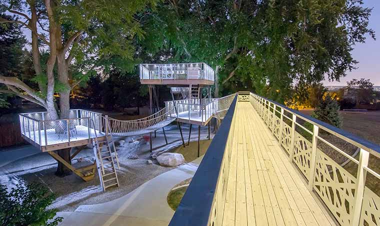 Catwalk bridge to the multi-level treehouse in Johnston, Iowa designed by Silent Rivers