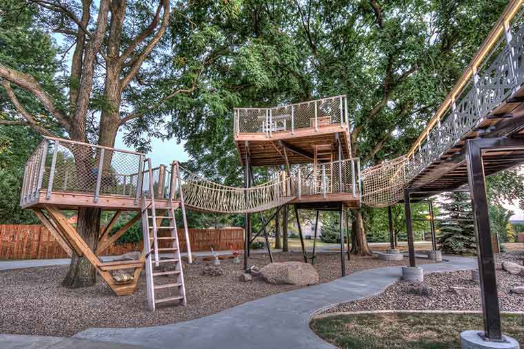 Elaborate treehouse in Johnston, Iowa designed by Silent Rivers