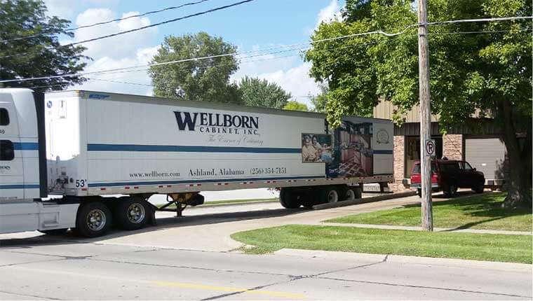 A truckload of pre-manufactured Wellborn Cabinets are delivered to Silent Rivers for an upcoming condo remodeling project in Des Moines