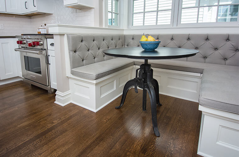 Breakfast nook banquette in a kitchen addition designed by Silent Rivers in a historic Des Moines colonial farmhouse