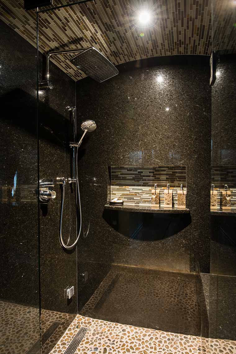 Granite steam shower with stone tile floor, granite slab tile walls and arched glass tile ceiling, bathroom remodel by Silent Rivers