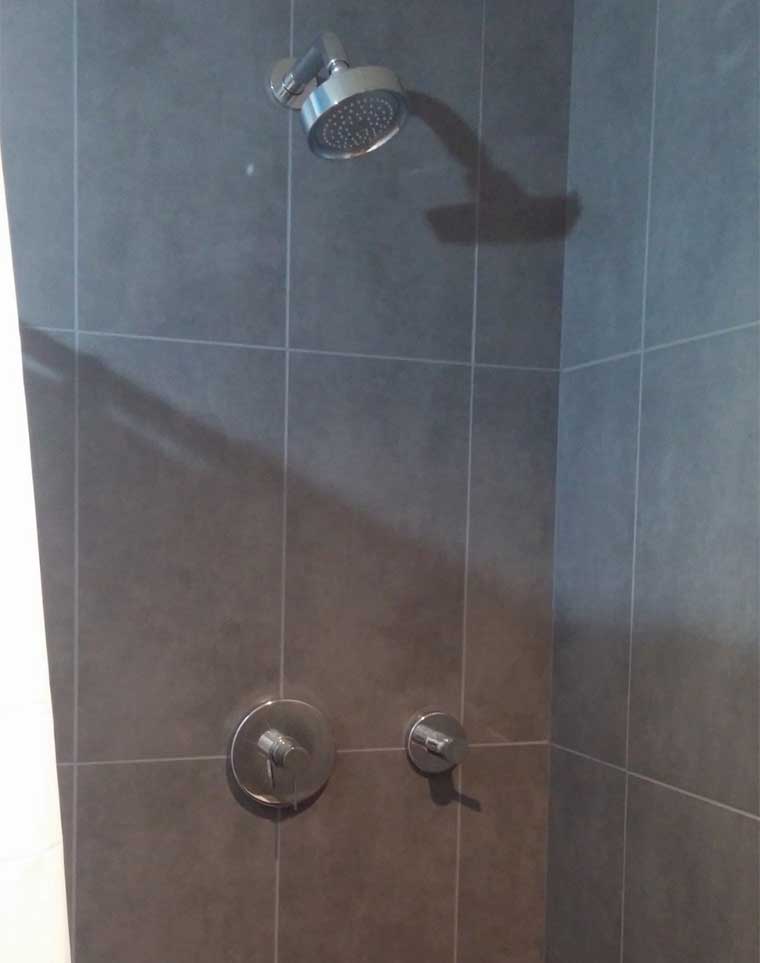 Shower with large gray tile