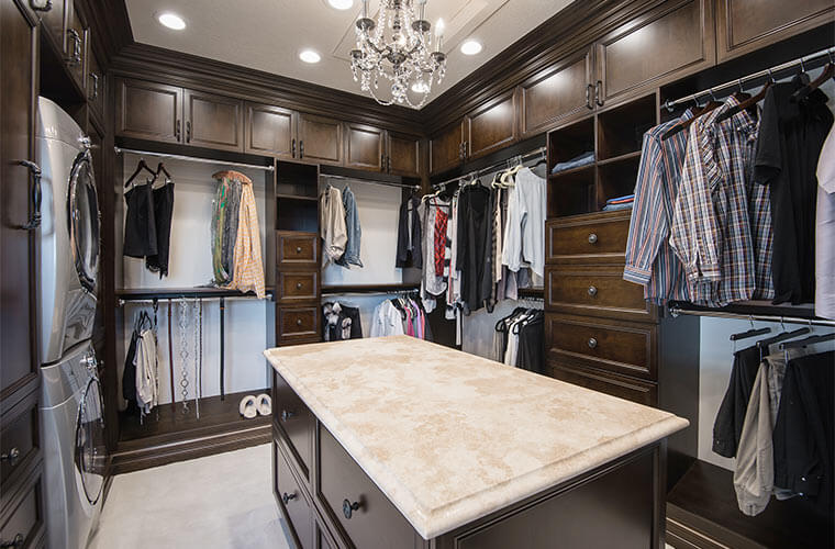 Urbandale-Iowa-luxurious-master-closet-by-Silent-Rivers with oversized drawers and travertine counter