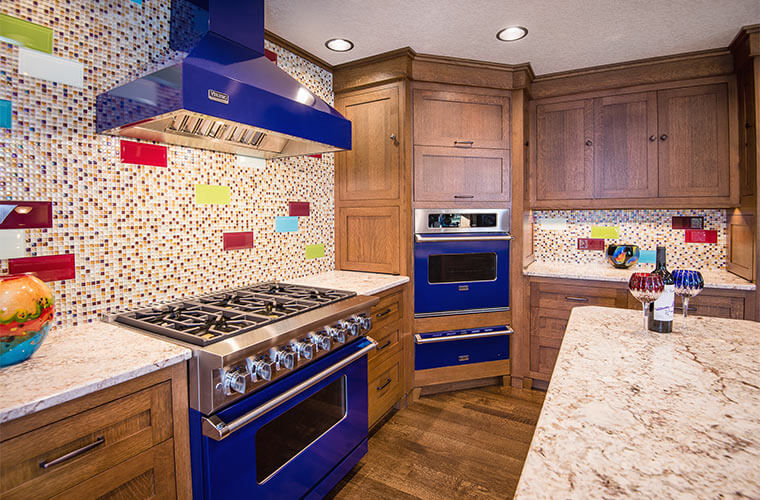 West Des Moines, Iowa craftsman kitchen remodel by Silent Rivers featuring cobalt blue appliances, art glass and quartersawn oak cabinets