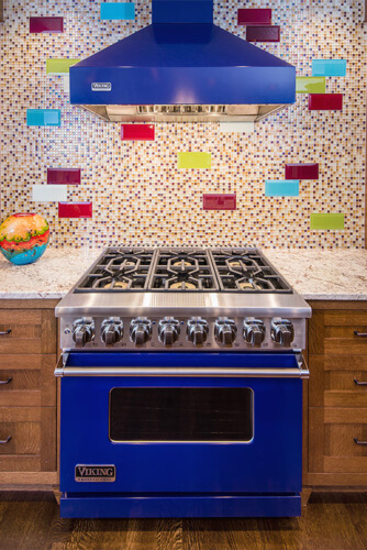 West Des Moines, Iowa craftsman kitchen remodel by Silent Rivers with colorful mosaic tile art glass and cobalt blue range