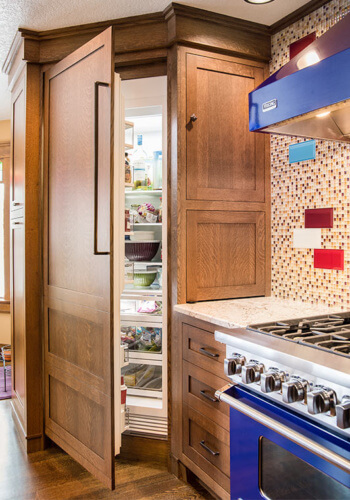 West Des Moines, Iowa craftsman kitchen remodel by Silent Rivers features custom paneled refrigerator door