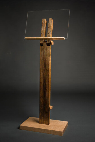 Music stand with maple wood mechanisms and a glass sheet music support custom designed by Silent Rivers, Des Moines, Iowa