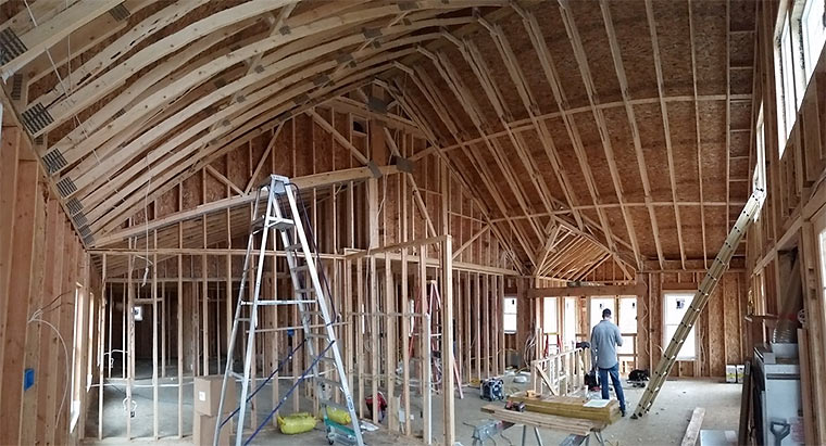 Rough-ins for plumbing, electrical and HVAC take place inside new house by Iowa homebuilder Silent Rivers Design+Build