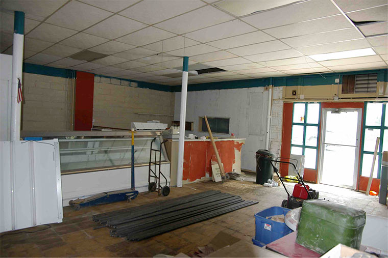 Remnants of old H&H Grocery Store interior before Silent Rivers began renovating and preservation of the building sustainable in the Sherman Hill Neighborhood of Des Moines