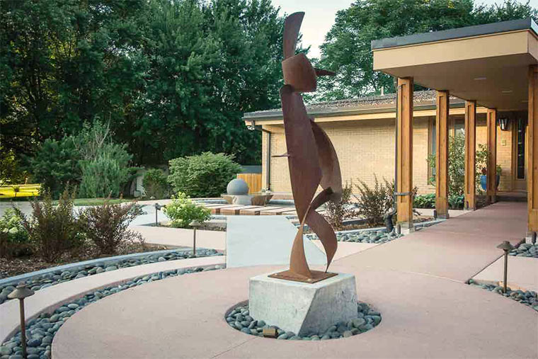 Sculpture in front courtyard of Johnston, Iowa home given new look by Silent Rivers