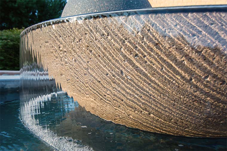 Waterfall closeup shows texture in Johnston, Iowa new front yard landscaping by Silent Rivers