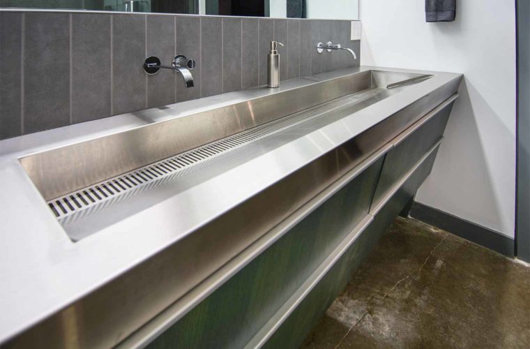 Stainless steel trough sink in downtown Des Moines loft remodel by Silent Rivers