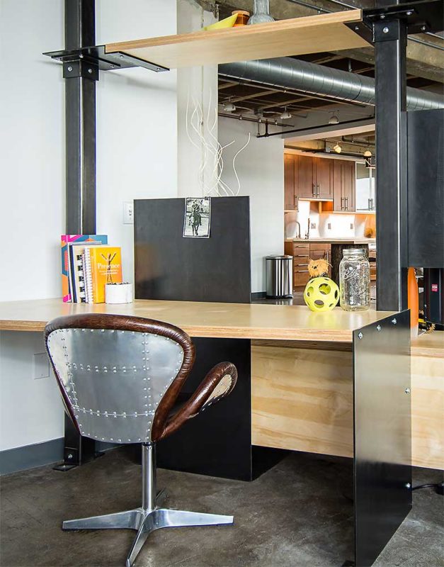Downtown Loft Transformation Unites Industrial and Organic Elements