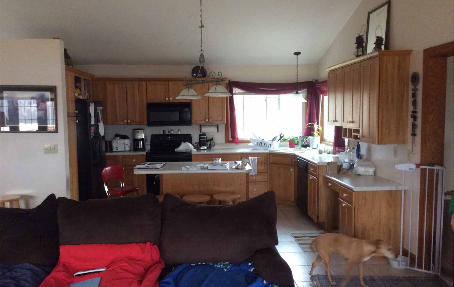 Before photo of kitchen to be remodeled by Silent Rivers of Des Moines shows hickory cabinets in good shape but layout needs better flow