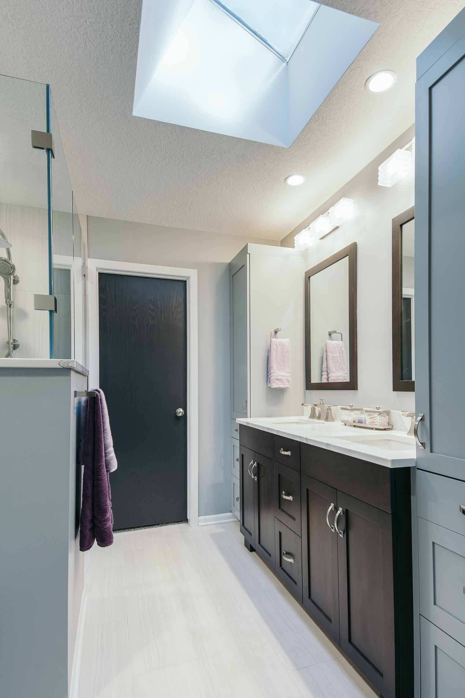 Skylight brings natural daylight into Des Moines bathroom by remodeler Silent Rivers