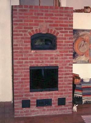 masonry stove heats srawbale house in New Mexico