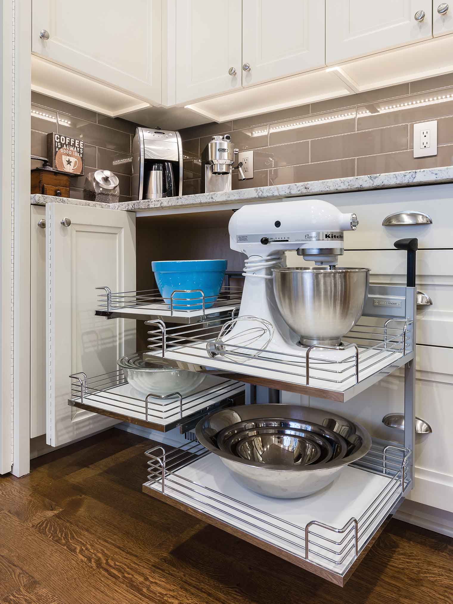 Magic corner cabinet for blind corner cabinet in West Des Moines Clive kitchen remodeler Silent Rivers allows Kitchen Aid mixer to come to you easily out of the corner cabinet