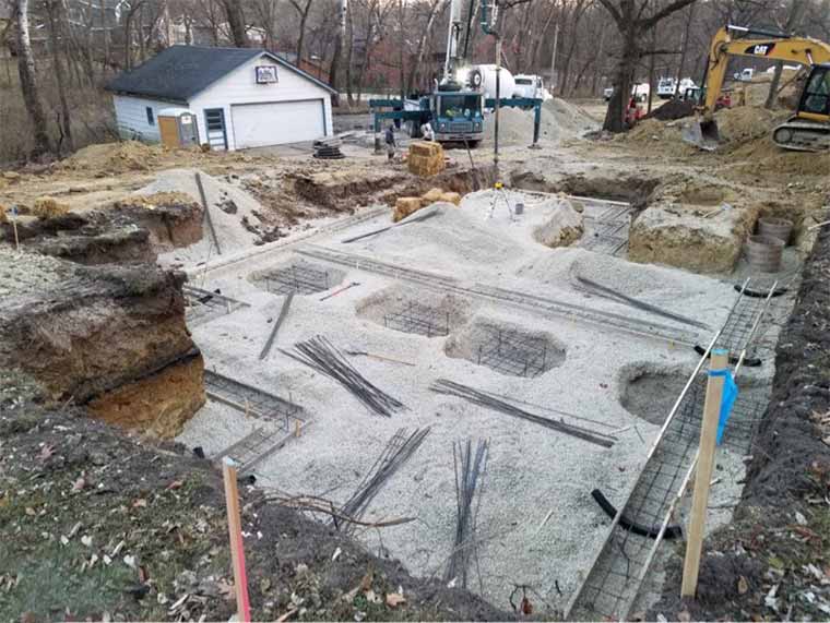 Foundation and footings are prepared for custom new home in Des Moines, Iowa being designed and built by Silent Rivers