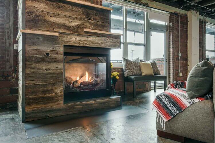 Downtown Loft Warms Up: Barn Wood, Birch and Steel Fireplace