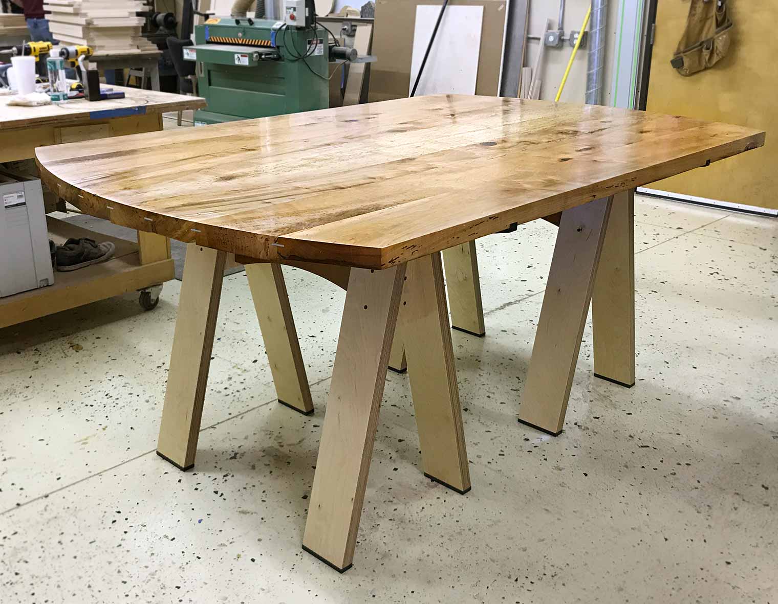 gathering table of rustic maple beams designed by Silent Rivers woodshop will host conversation at Des Moines Arts Festival VIP Club