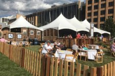 2017 Des Moines Arts Festival Silent Rivers VIP Club where Festival Patrons enjoy seated tables and a large tent