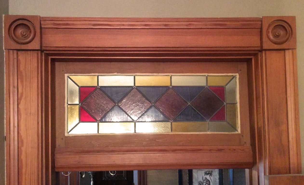 stained glass transom window in Victorian Des Moines home about to get a makeover by kitchen designer and remodeler Silent Rivers Design+Build of Des Moines
