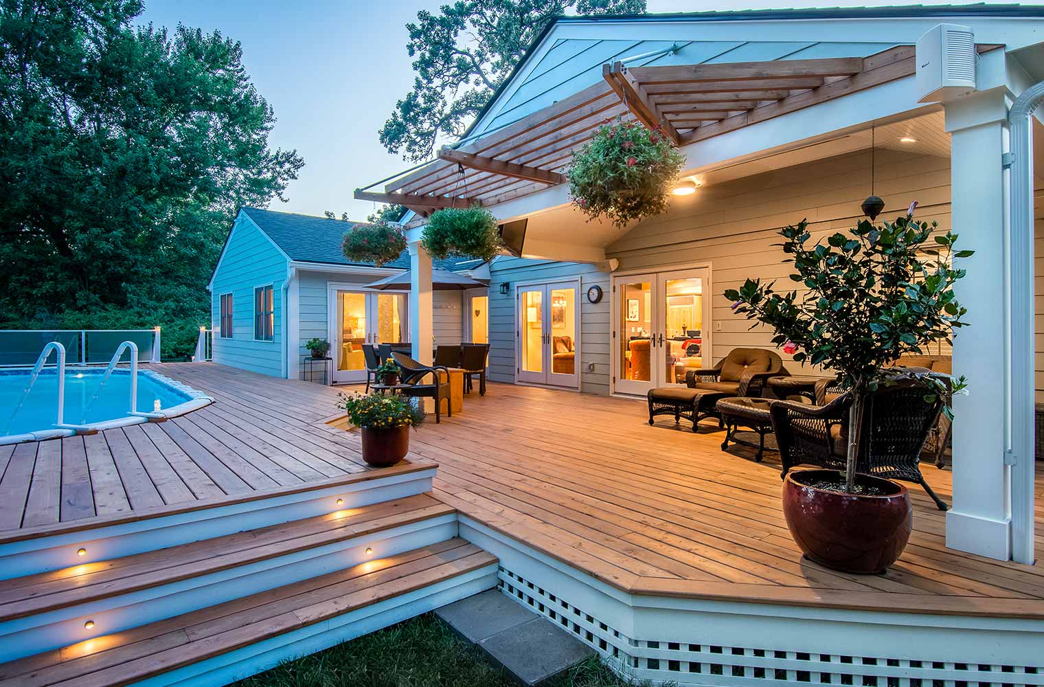 pool decking and covered patio on midcentury ranch home in Des Moines, Iowa by remodeler Silent Rivers