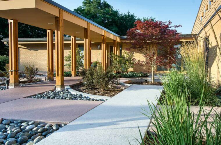contemporary front entry courtyard with Japanese maple in concentric circle design in Johnston, Iowa by Silent Rivers