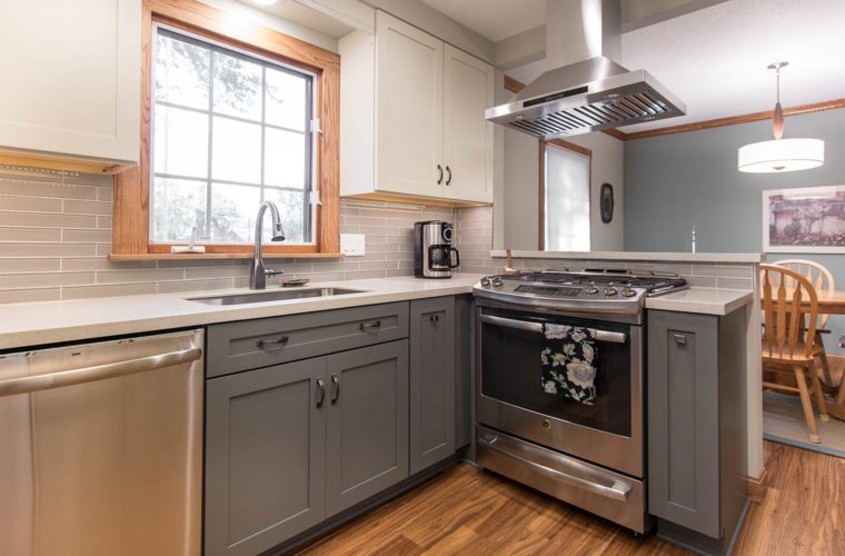 transition white and gray remodel of 1980s galley small kitchen in Des Moines by designer builder Silent Rivers