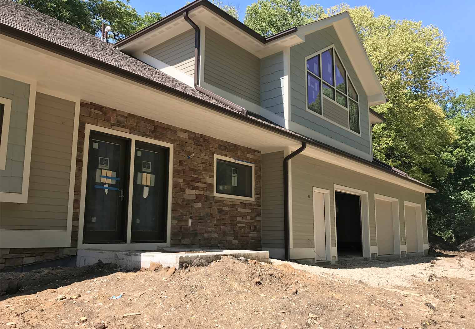 Home exterior finishing on Des Moines custom new home by builder Silent Rivers