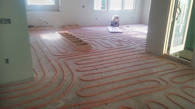 in-floor heating installation in custom new home in Des Moines by builder Silent Rivers