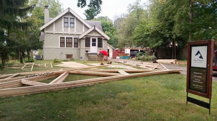 trusses arrive for Des Moines Drake Craftsman bungalow addition by Silent Rivers