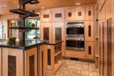 custom cabinets in maple with steel inserts in Johnston, IA kitchen remodel by Silent Rivers Design+Build