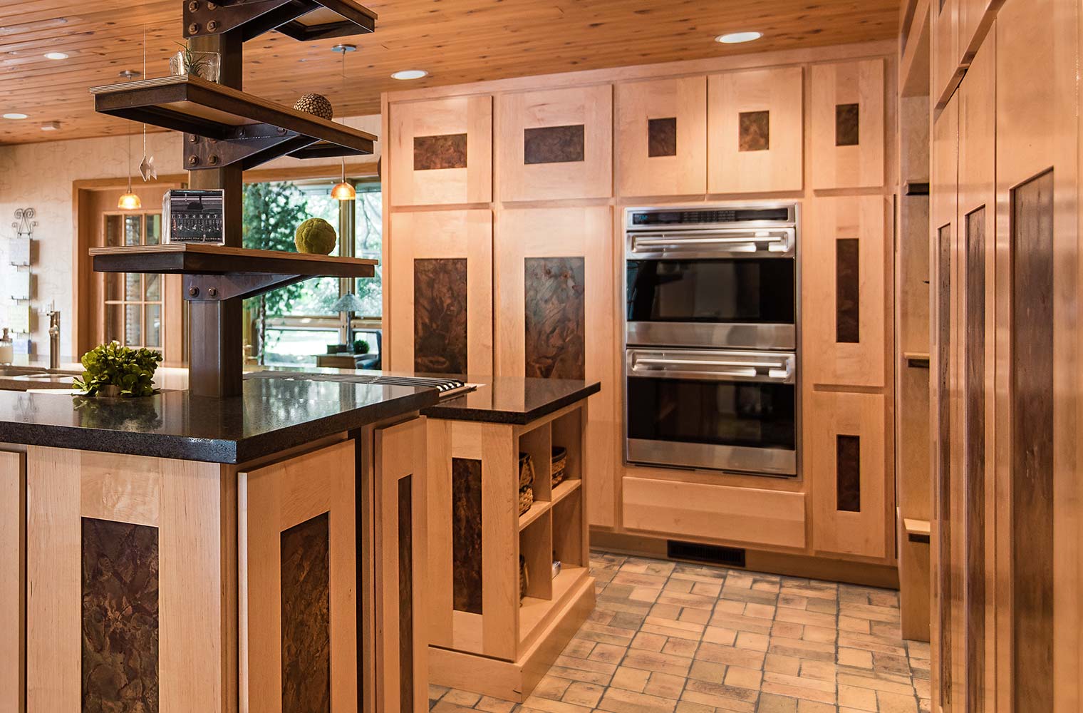 custom cabinets in maple with steel inserts in Johnston, IA kitchen remodel by Silent Rivers Design+Build