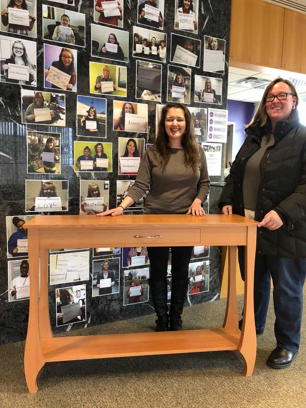 YWRC staff receives custom table donated by Silent Rivers to the YWRC auction