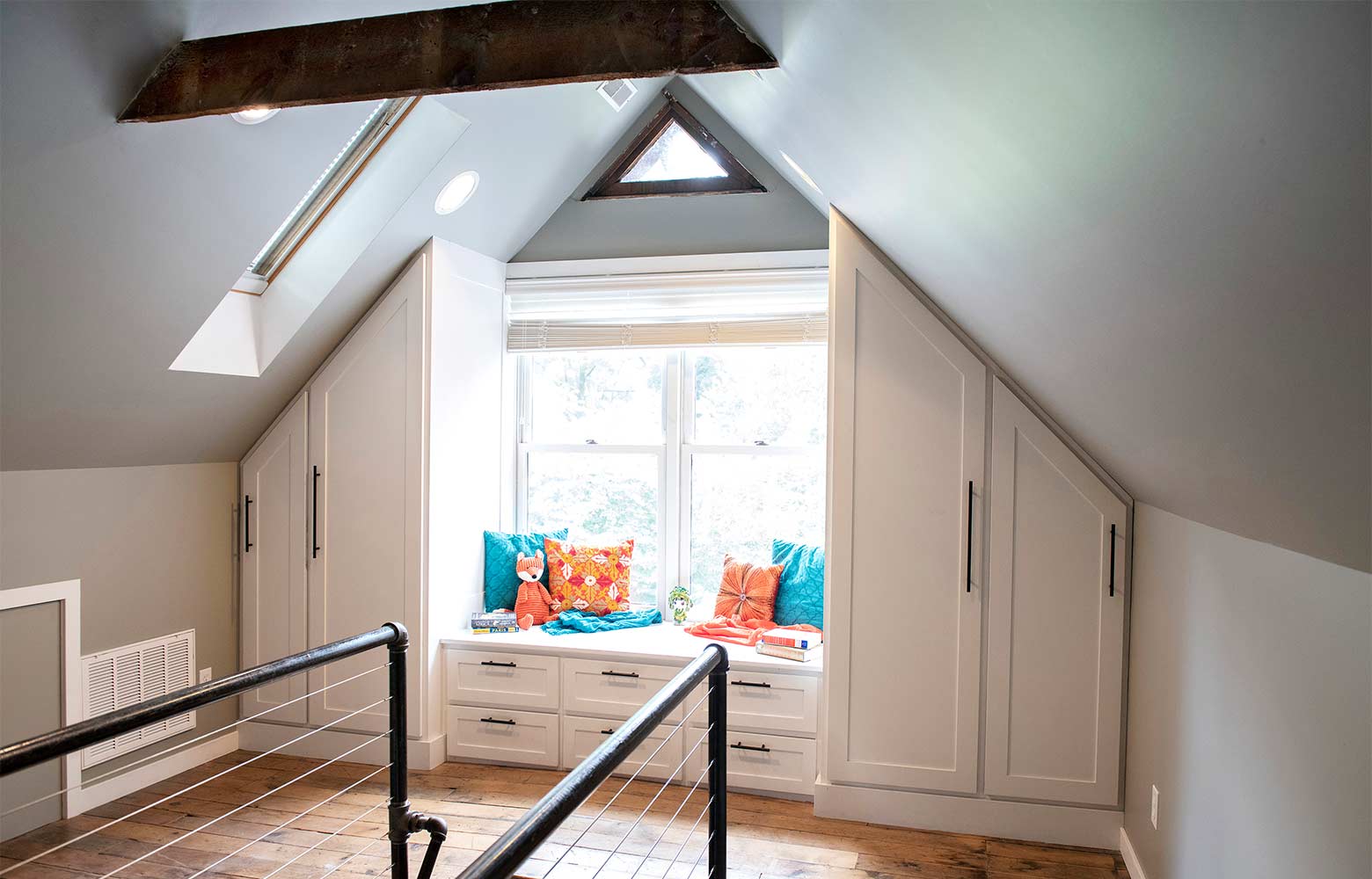 Victorian home renovation in Des Moines by Silent Rivers, attic with new gable and built-in storage