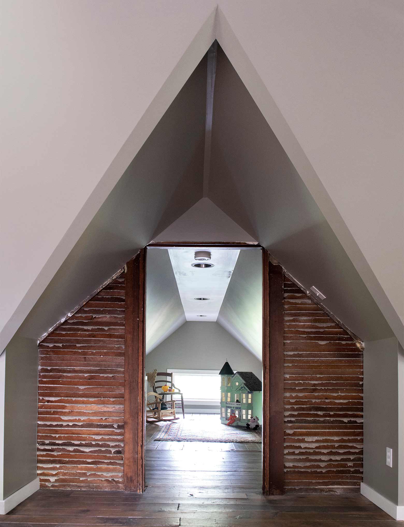 Victorian home renovation in Des Moines by Silent Rivers, attic with exposed lathe wall