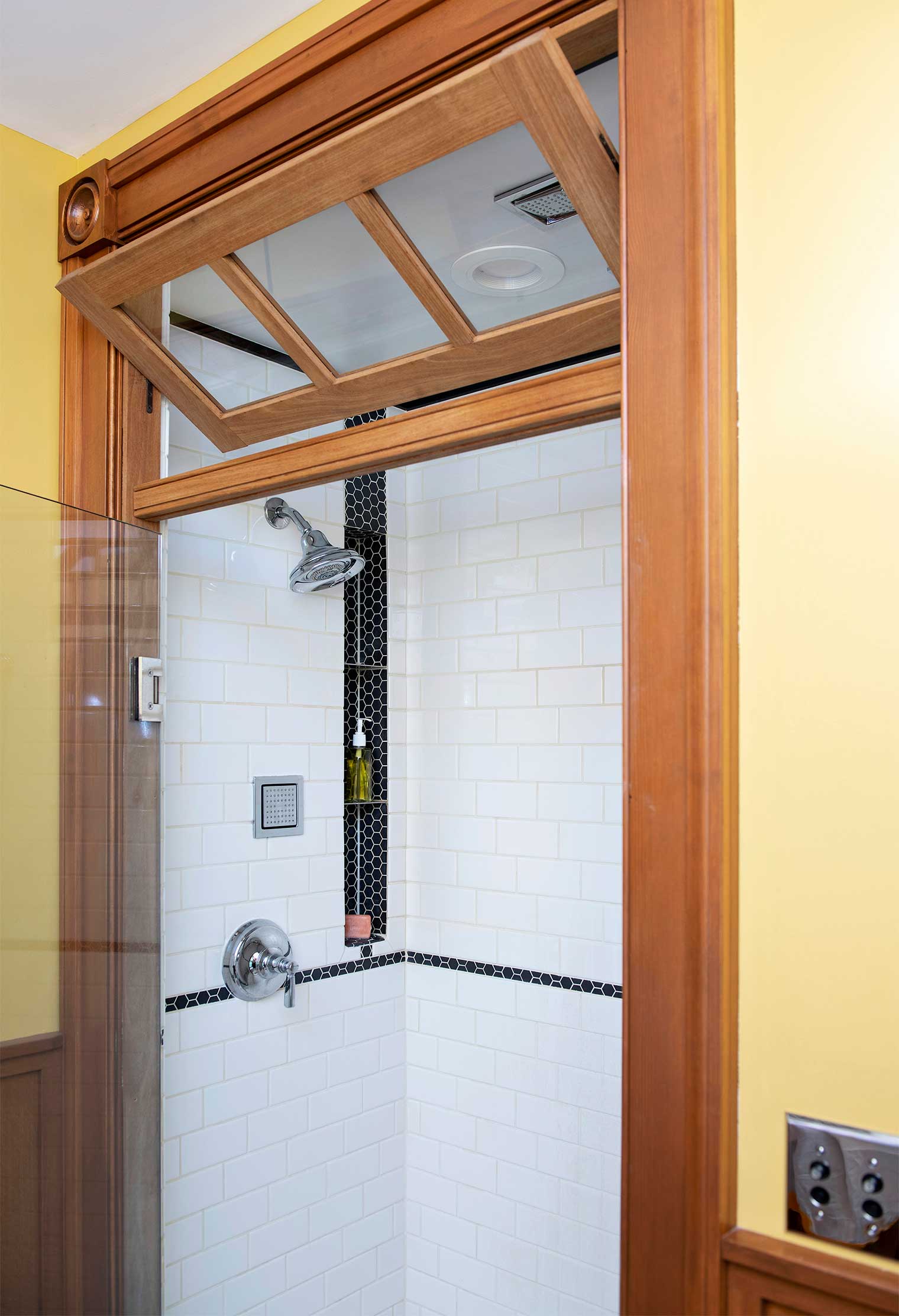 bathroom remodel in a Des Moines Victorian home renovation by Silent Rivers features hexagon tile shower