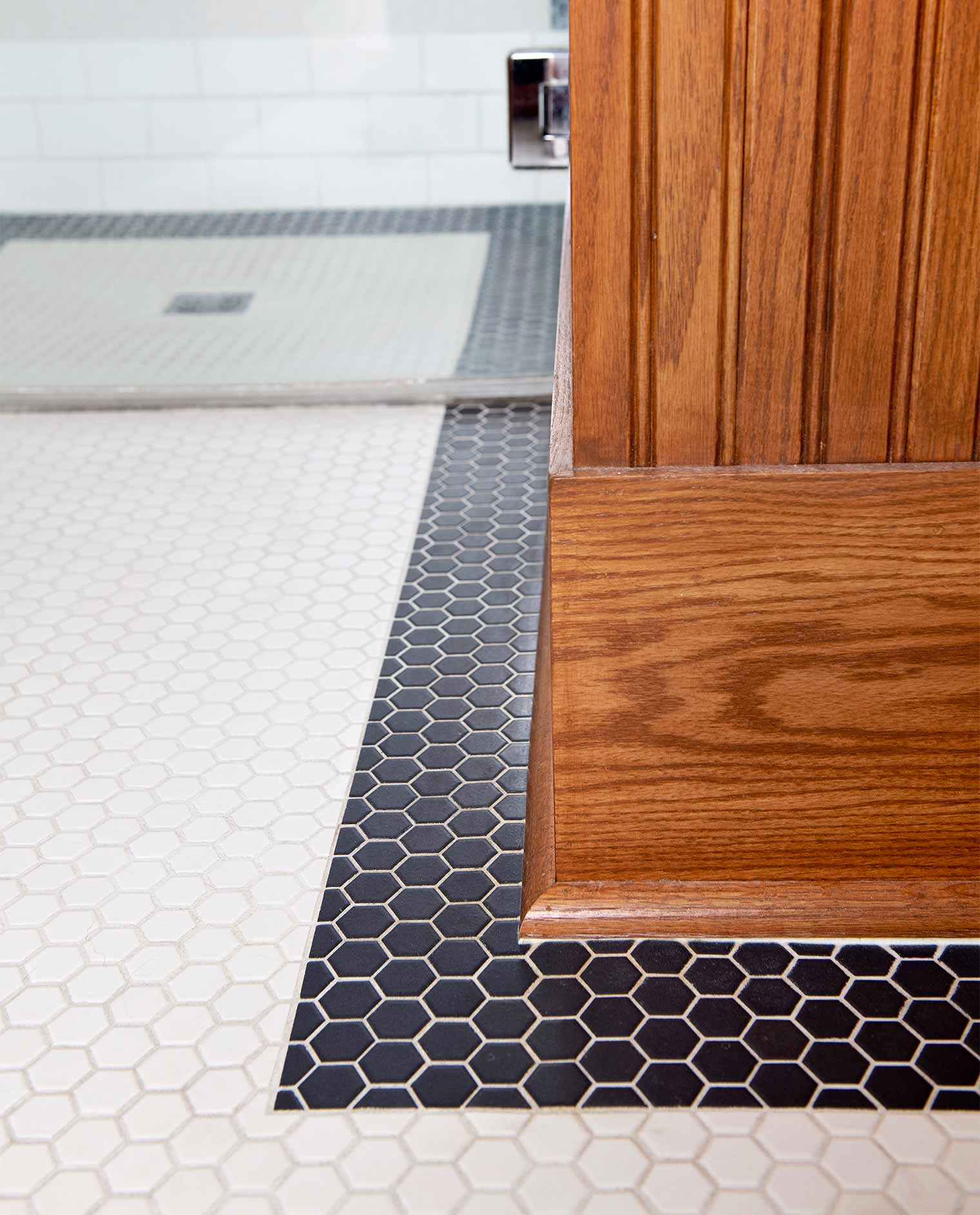 bathroom remodel in a Des Moines Victorian home renovation by Silent Rivers features hexagon tile